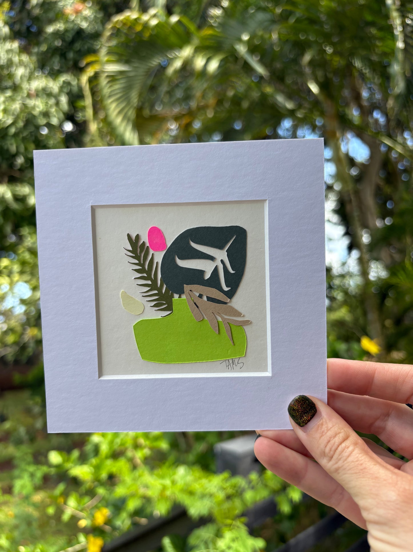 Matted artwork with a stylized tropical illustration 