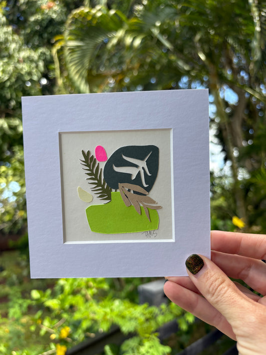 Matted artwork with a stylized tropical illustration 